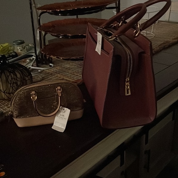 Coach medium hand bag.  About 7 inches wide.  More maroon than purple. - Picture 2 of 3